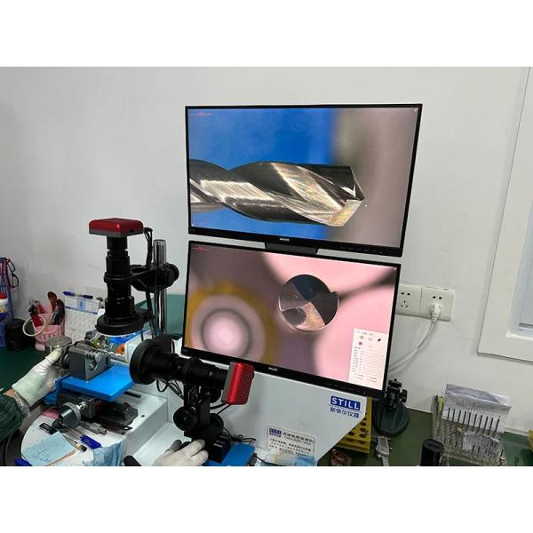 Quality control technician examining carbide burrs
