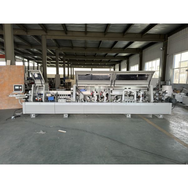 BHM388YJ Edge Banding Machine - Side view displaying conveyor system and trim stations