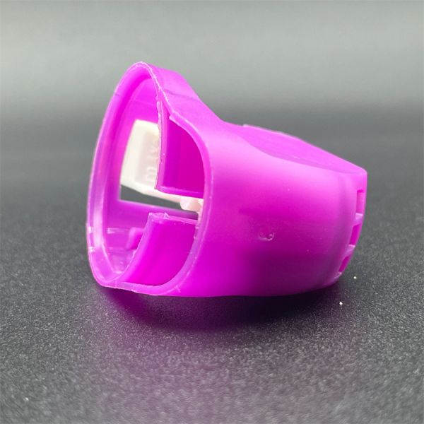 Close-up of spray gun's adjustable nozzle mechanism