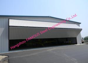 China Dual Panel Bi Folded Hangar Door Upper Folding Industrial Doors With Hard Metal Sandwich Panel on sale