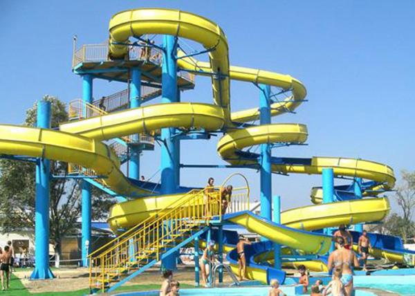 Quality Blue Yellow Water Park Slide Combined , Fiberglass Large Spiral Slide Equipment for sale