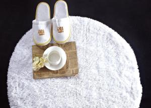 Wholesale Washable White Waffle Disposable Spa Slippers , Disposable Hotel Bathroom / Guest House Slippers from china suppliers